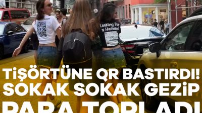 Amerika'da bir vatandaş tişörtüne QR kodu bastırıp çevreden para istedi.